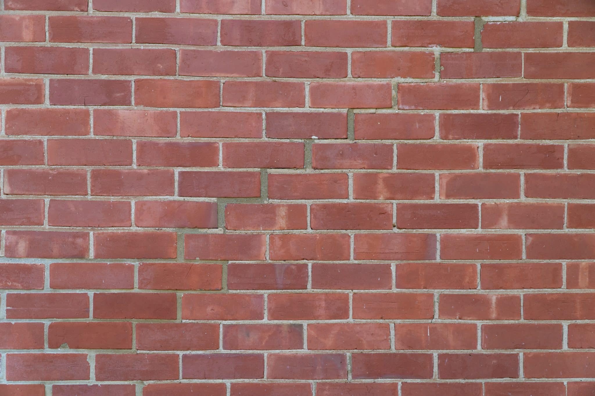 Clean brick wall with vibrant red tones.