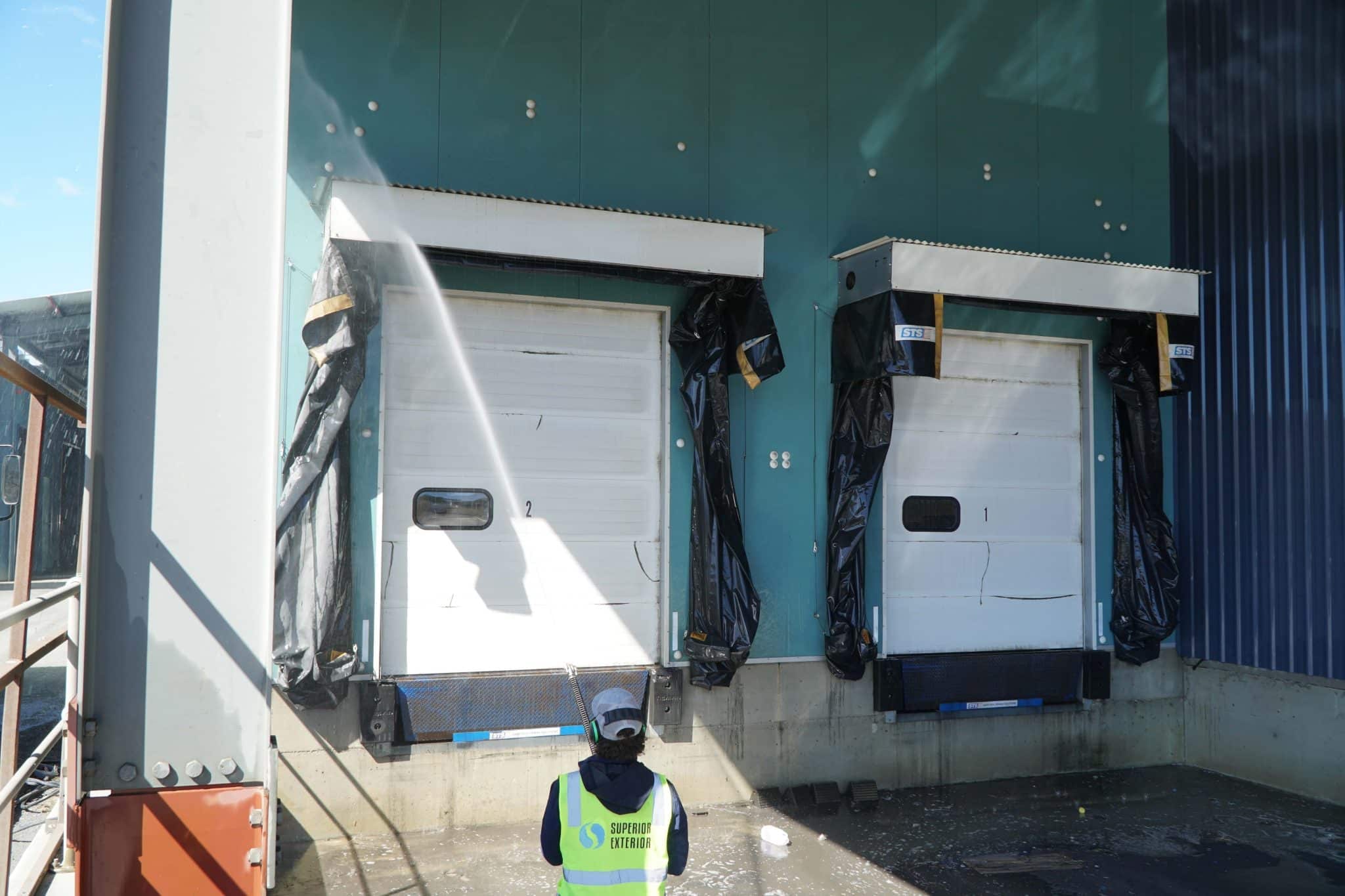 The loading bay in Adelaide is being cleaned with pressure washing.