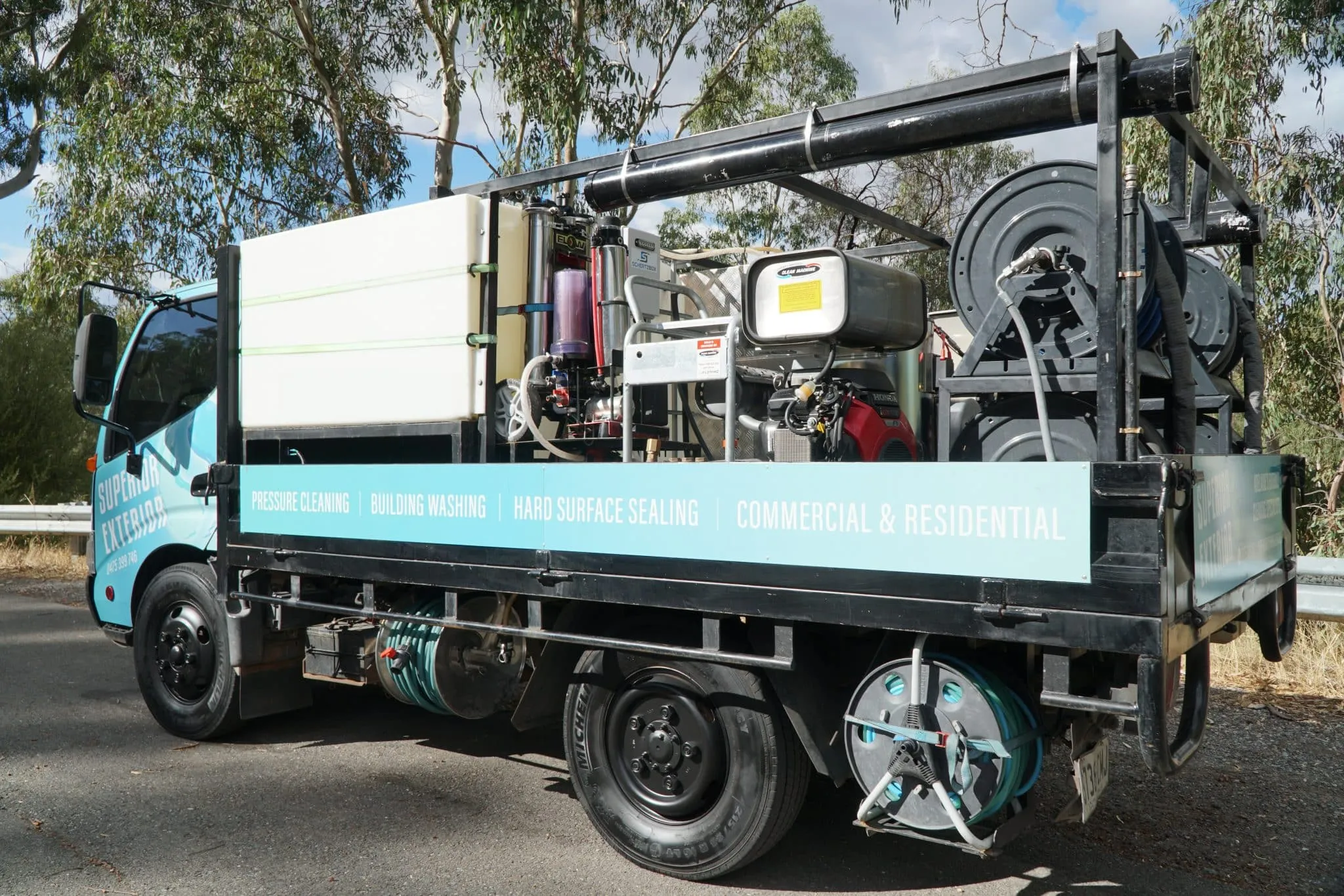 Commercial pressure cleaning Adelaide in progress on a building exterior.