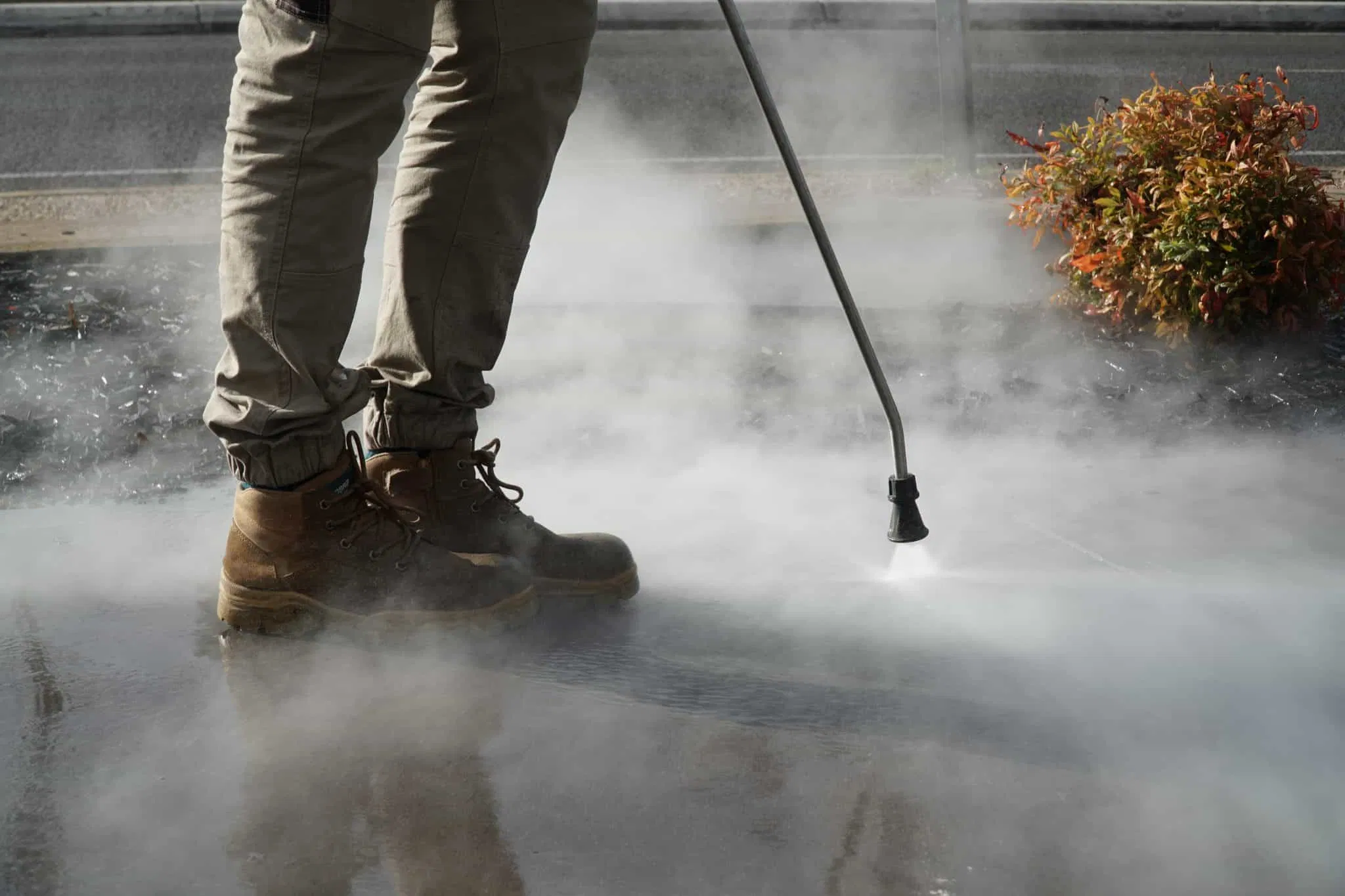 Heavy-duty cleaner being used on an outdoor concrete patio