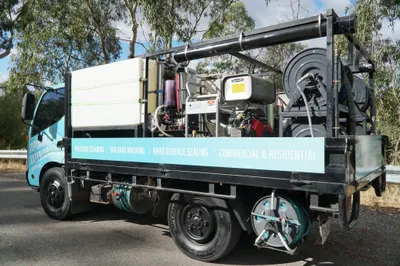 Commercial pressure cleaning Adelaide in progress on a building exterior.